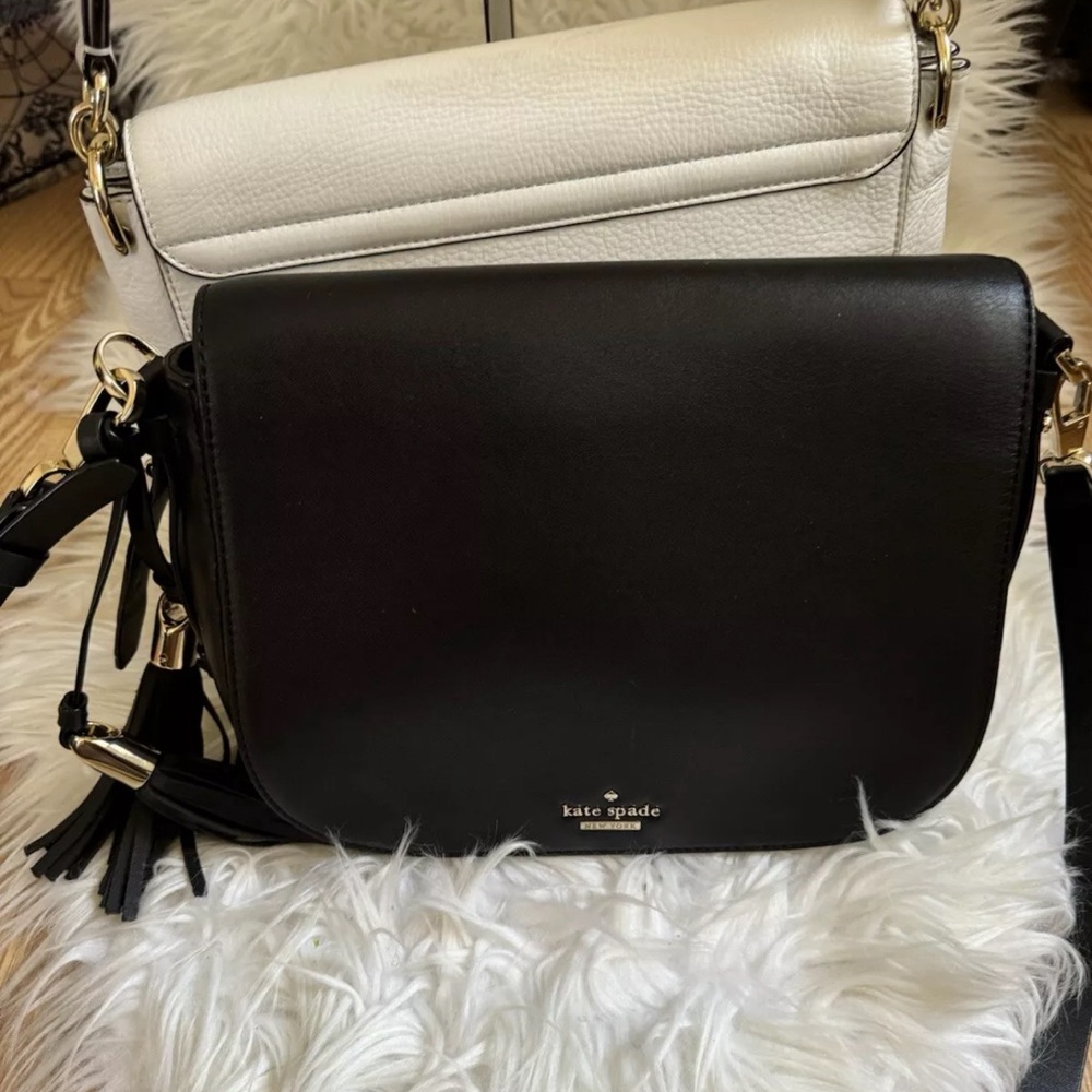 Kate spade black leather handbag with tassel .Excellent condition